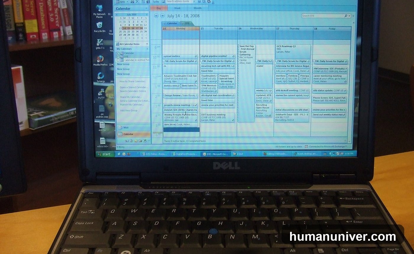 Person feeling overwhelmed at a work desk with a laptop